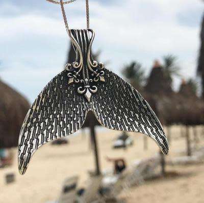 A mermaids tail pendant and free chain!!