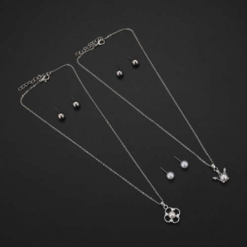 Captivating 5 piece jewelry set!! 2 pendants and 3 sets of earrings with 2 free chains!!