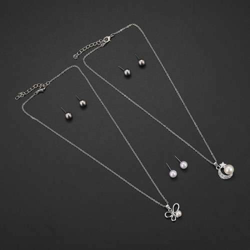 Captivating 5 piece jewelry set!! 2 pendants and 3 sets of earrings with 2 free chains!!
