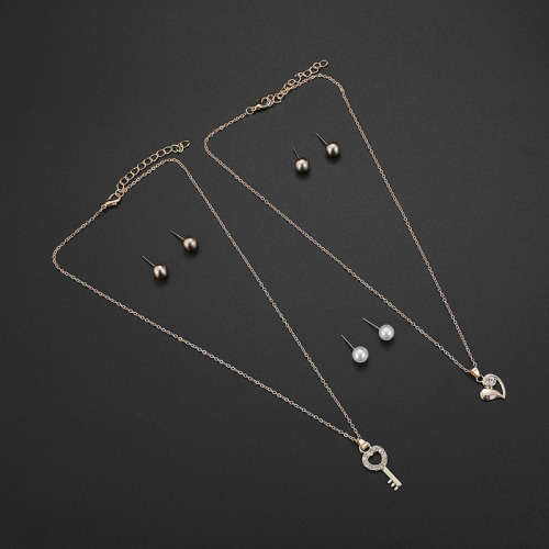Captivating 5 piece jewelry set!! 2 pendants and 3 sets of earrings with 2 free chains!!