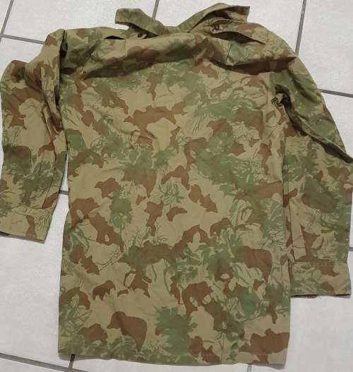 KOEVOET. CAMO LONG SLEEVE BUSH SHIRT. BATTLE WORN. FIRST INTAKE 1979.
