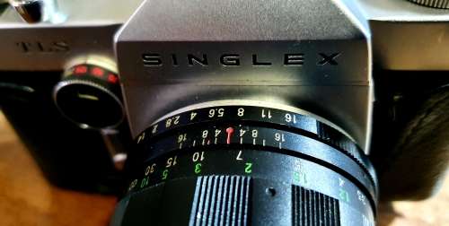 SINLEX TLS 55mm LENS CAMERA WITH LEATHER CASE.