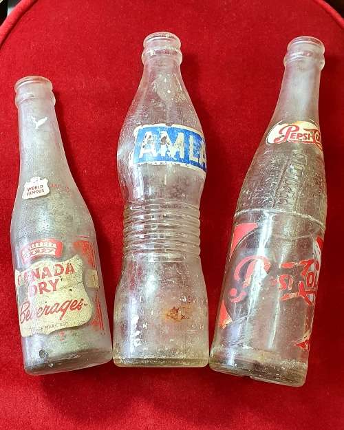1950 -1956 COOL DRINK BOTTLE COLLECTION. PEPSI : CANADA DRY , AMLA.