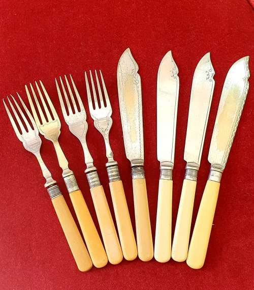 ANTIQUE BONE HANDLE FISH KNIFES AND FORKS SET . CIRCA 1910 .