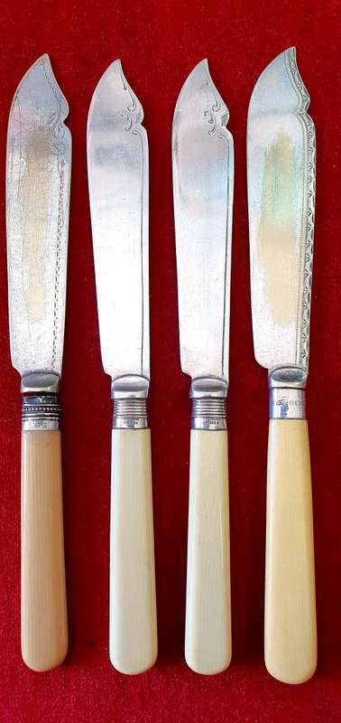 ANTIQUE BONE HANDLE FISH KNIFES AND FORKS SET . CIRCA 1910 .