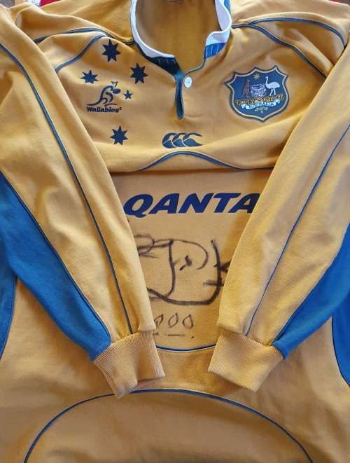AUTHENTIC WALLABIES TEAM REPLICA JERSEY. SIGNED BY JONAH LOMU. XL. 2000