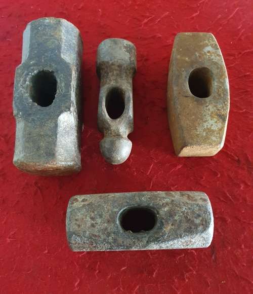 4 X  HUGE ANTIQUE BLACK SMITH FORGING HAMMER HEADS.