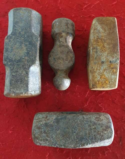 4 X  HUGE ANTIQUE BLACK SMITH FORGING HAMMER HEADS.