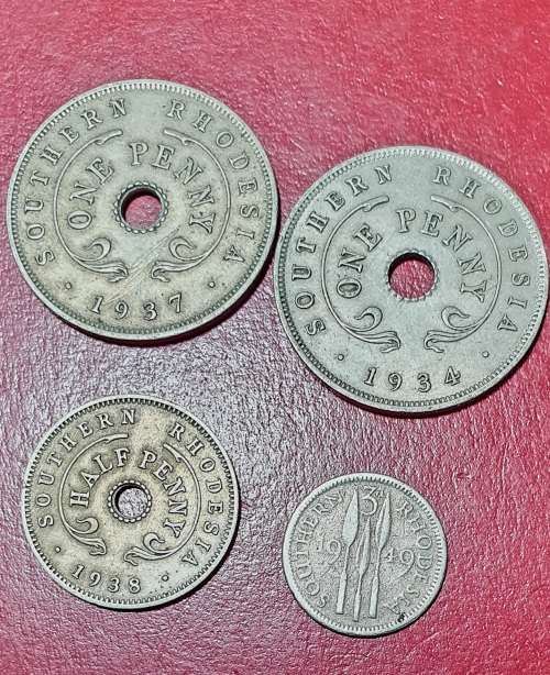4 X SHOUTHERN RHODESIA COINS . 2 X ONE PENNY, 1 X HALF PENNY, 1 X 3D.