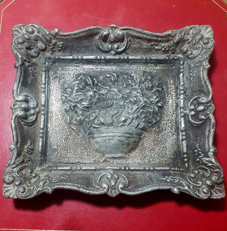 Antique cast iron framed flowers wall plate.