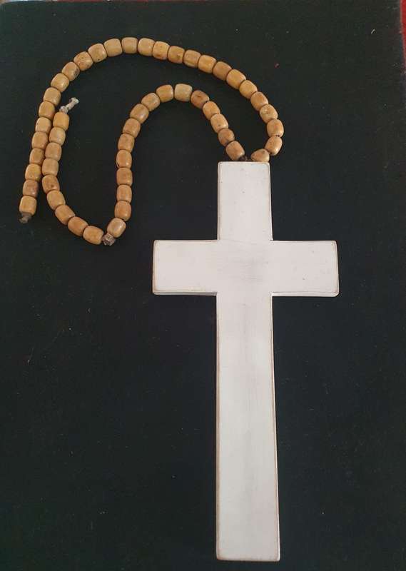 Huge wood cross with wooden beads.