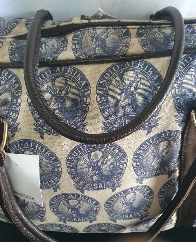 MONGOOSE HANDCRAFTED WEEKEND BAG WITH OLD SA STAMP LOGO.  UNUSED.