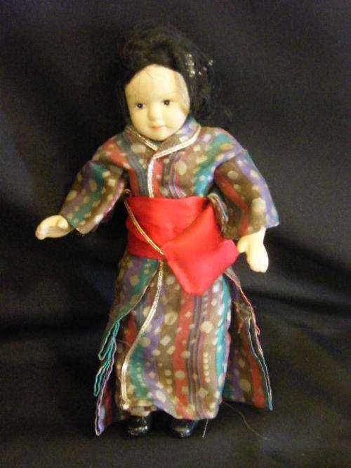 Ethnic porcelain doll as per photo