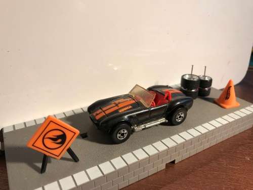 Hot Wheels AC Cobra from late 80s. Black with Black wall Tyres