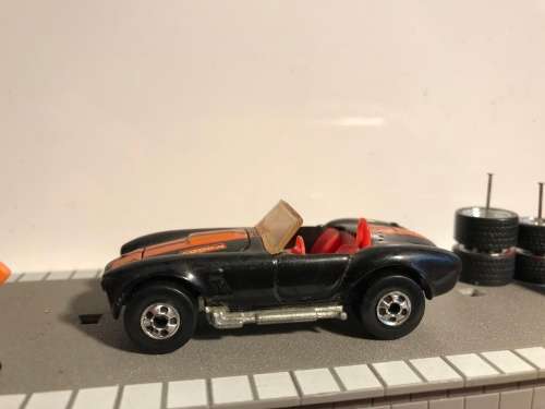 Hot Wheels AC Cobra from late 80s. Black with Black wall Tyres