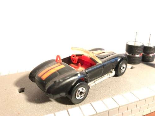 Hot Wheels AC Cobra from late 80s. Black with Black wall Tyres