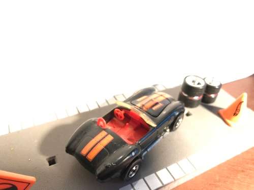 Hot Wheels AC Cobra from late 80s. Black with Black wall Tyres