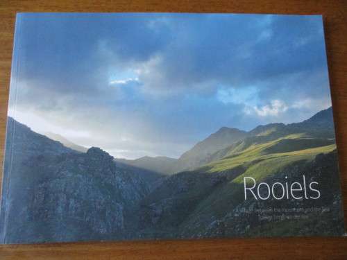 ROOIELS  A village between the mountains and the sea  Tussen berge en see