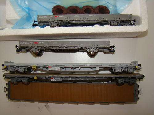 Marklin (1) and HAG (2) Stake Cars and Roco HO Gondolas (one with load)