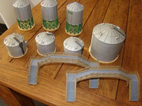 HO scale storage tanks (7) and overhead passenger bridges (2)