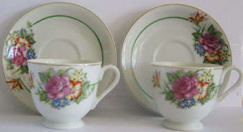 MINIATURE VINTAGE TEA CUP AND SAUCER SET