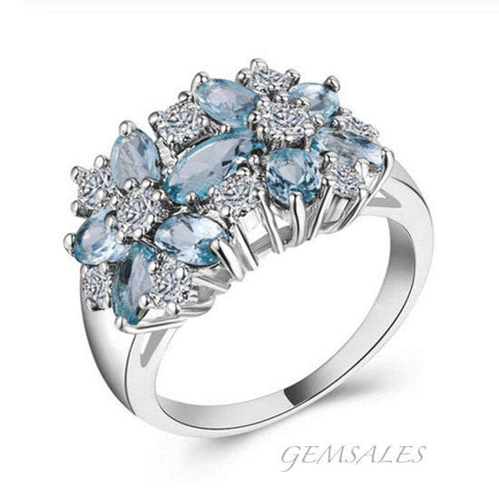 EXQUISITE SKY BLUE CZ IN FLOWER SETTING  *S925*  SIZES   6  /  8  /  9     AVAILABLE