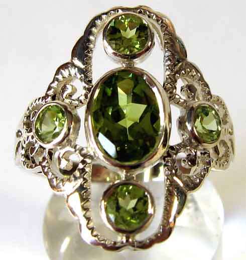 Beautiful , Sterling Silver and Genuine Peridots Ring.