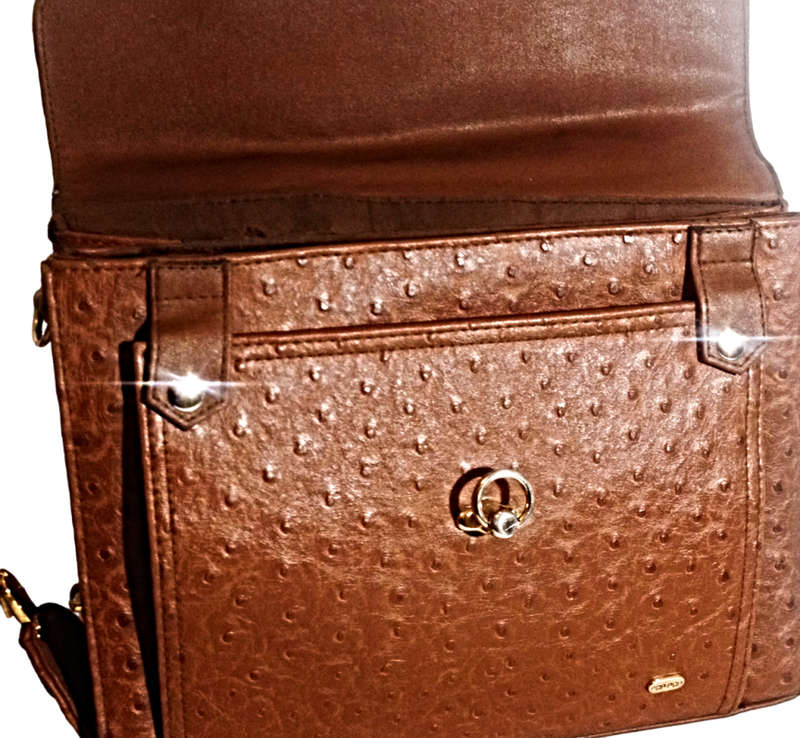 Elevate your accessory game with this exquisite brown leather vintage treasure