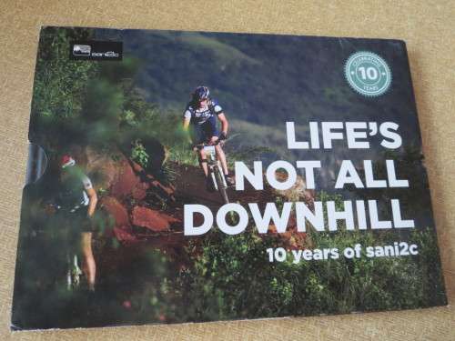 NOT ALL DOWNHILL  10 years of sani2c  (Mountain bikers) (In slipcase)