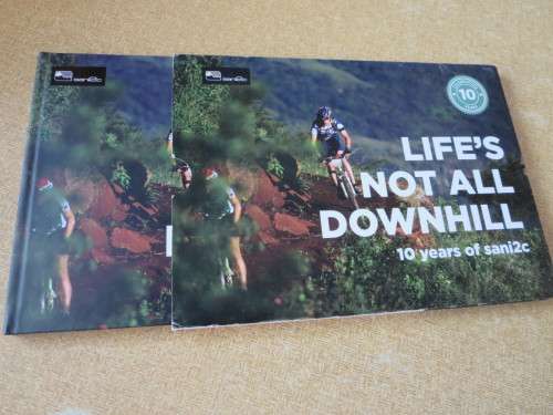 NOT ALL DOWNHILL  10 years of sani2c  (Mountain bikers) (In slipcase)