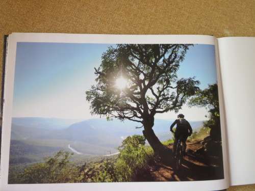 NOT ALL DOWNHILL  10 years of sani2c  (Mountain bikers) (In slipcase)
