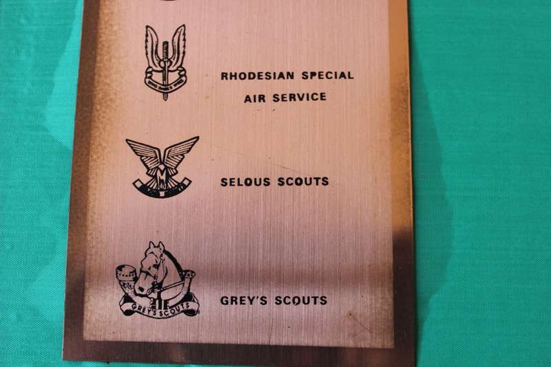 TWENTY RHODESIAN MILITARY BADGES MOUNTED IN SMART LEATHERLIKE BOX