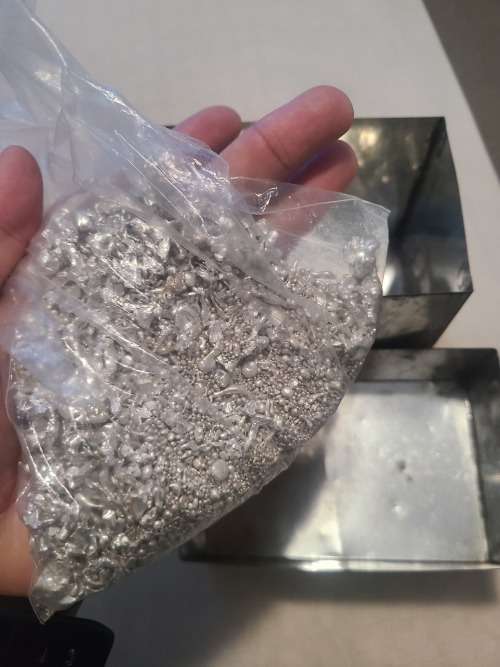 Silver .999 granules 27.595 OZ inside vintage SA Munt tin.
