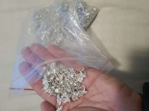 Silver .999 granules 27.595 OZ inside vintage SA Munt tin.