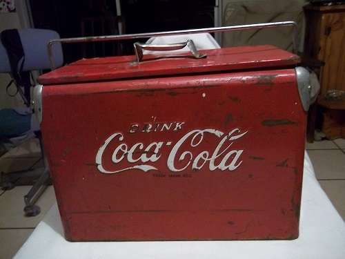 Vintage 1940s Coca-Cola ice box with opener on the side