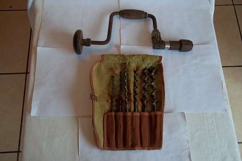 Vintage brace drill and 6 auger bits in a canvas bag