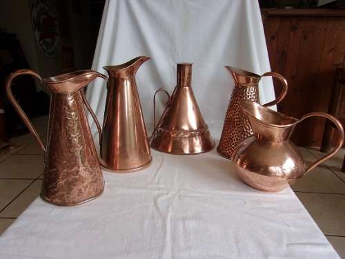 4 Large vintage copper jugs/ pitchers and an antique copper kettle for 1 bid
