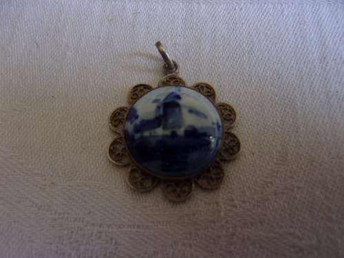 Vintage blue and white Delft porcelain pendant with silver surround