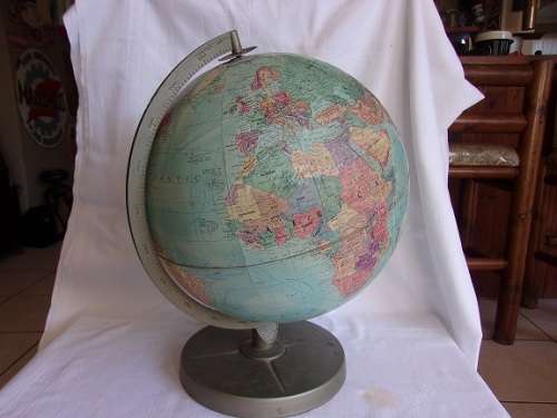 Large vintage Replogle world globe on metal rotating stand