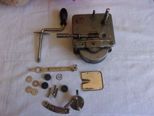 Vintage wind up gramophone motor, crank handle and speed regulator unit - still in original box