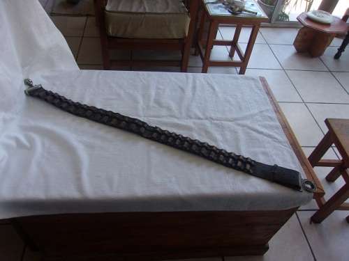 Vintage ammunition bandolier with lion head buckle