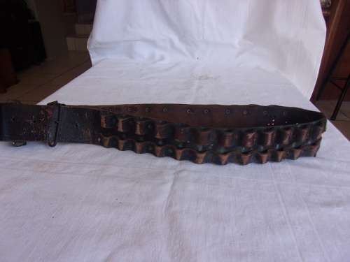 Vintage ammunition bandolier with lion head buckle