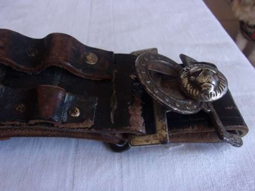 Vintage ammunition bandolier with lion head buckle