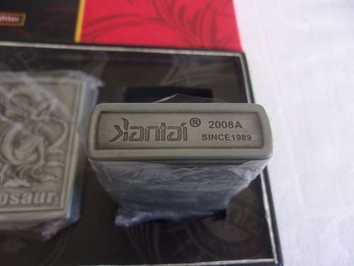 Boxed Smoking Set of 4 Jiantai fuel cigarette lighters - dinosaur theme
