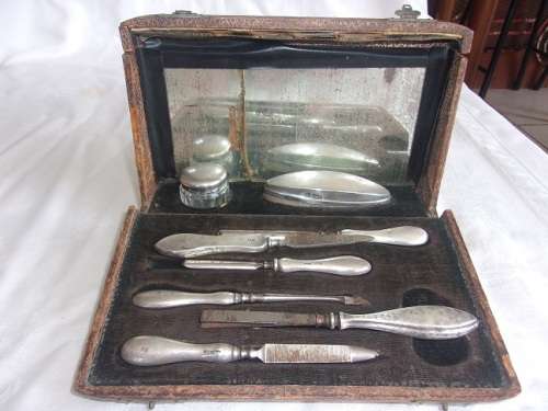 Vintage cased Sterling silver handle/lid manicure set and mirror