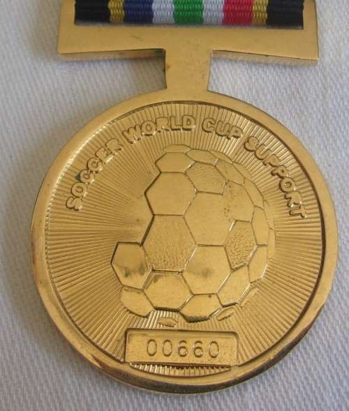 2010 gold plated SAPS Soccer World Cup Support medal with ribbon
