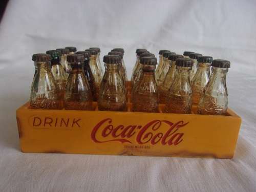 Vintage miniature yellow Coca-Cola crate with 24 glass miniature Coca-Cola bottles