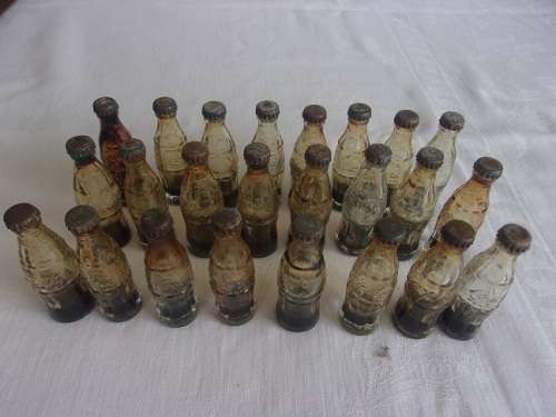 Vintage miniature yellow Coca-Cola crate with 24 glass miniature Coca-Cola bottles