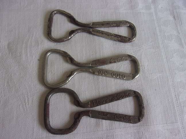 Lot of 8 vintage Coca-Cola bottle openers for 1 bid