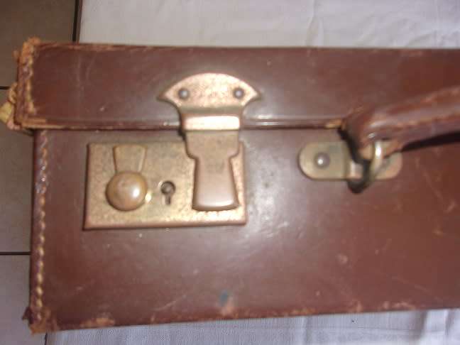 Small vintage leather attache case with brass latches
